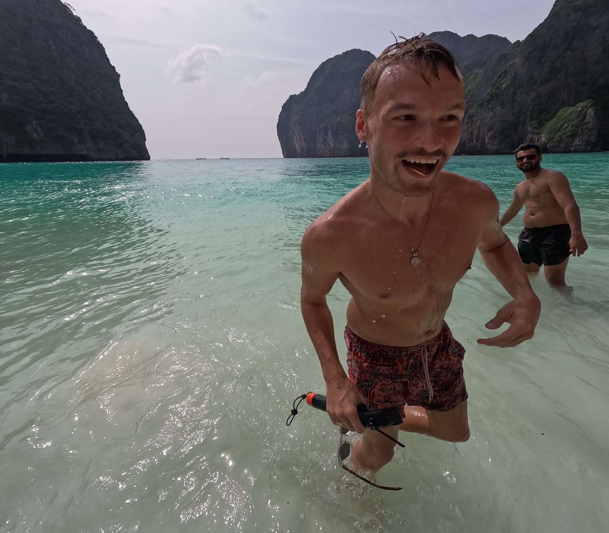 Pirate ship cruising past limestone cliffs