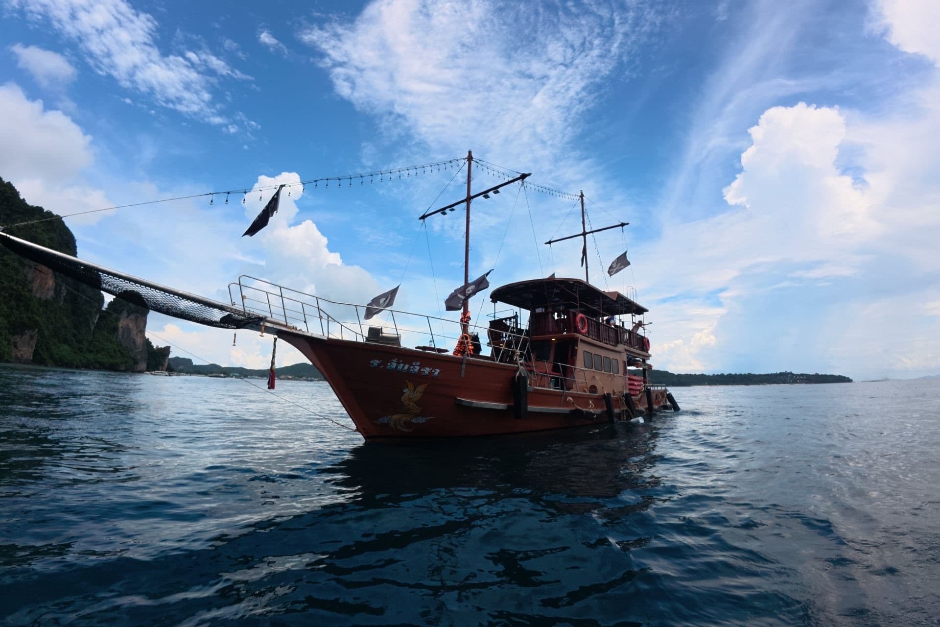 Low-angle of the Phoenix bow under a dramatic sky