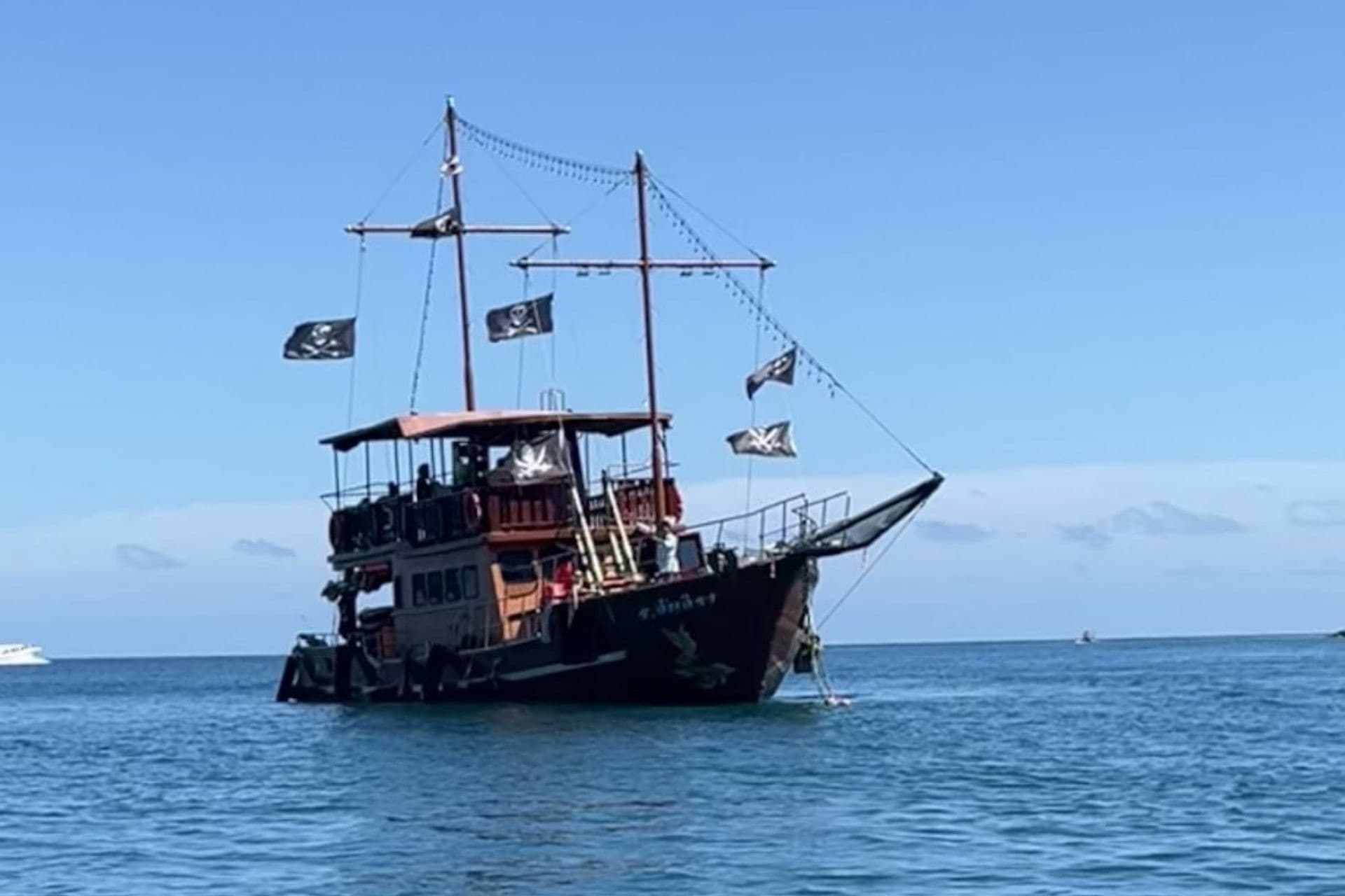 The Phoenix anchored on the open blue sea